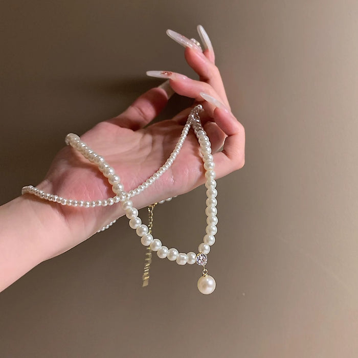 Wholesale Retro pearl double layered necklace with high-end feel, light luxury, niche collarbone chain