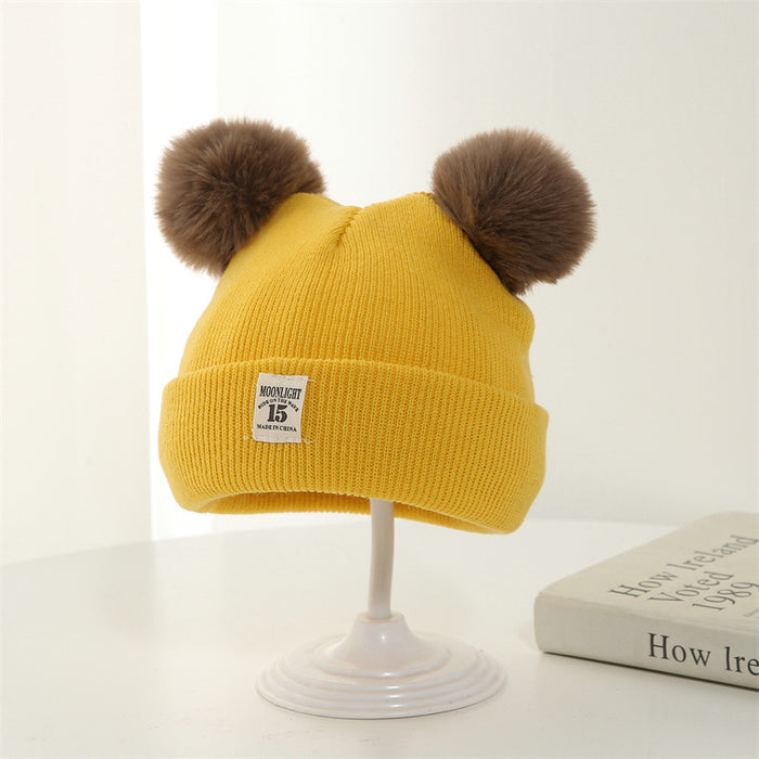 Wholesale Knitted hat with added yarn cap and fabric label