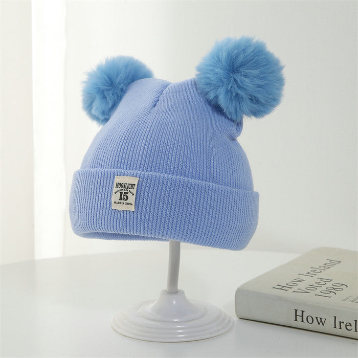 Wholesale Knitted hat with added yarn cap and fabric label