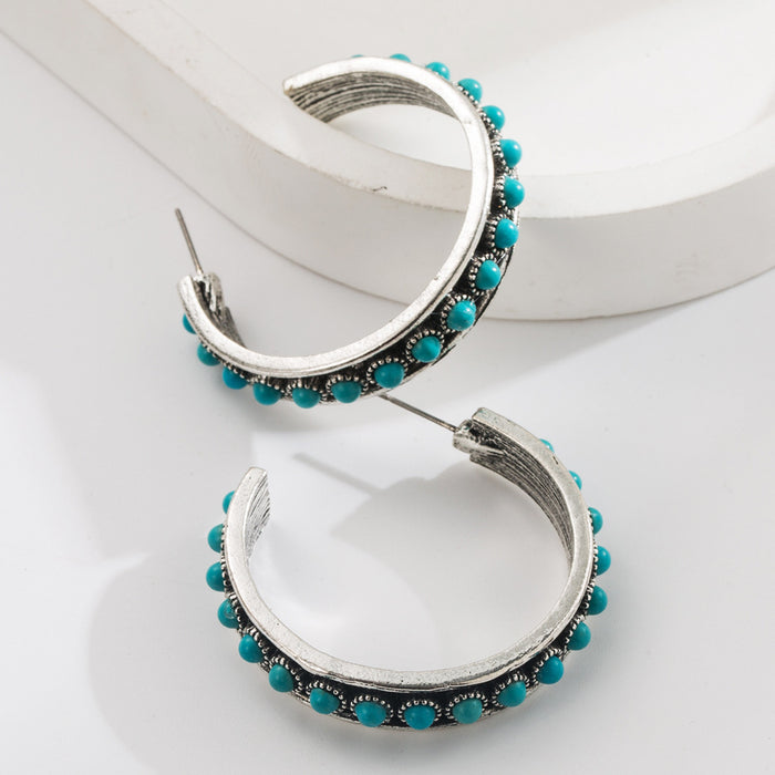 Wholesale Large C-shaped alloy statement earrings set with white and turquoise