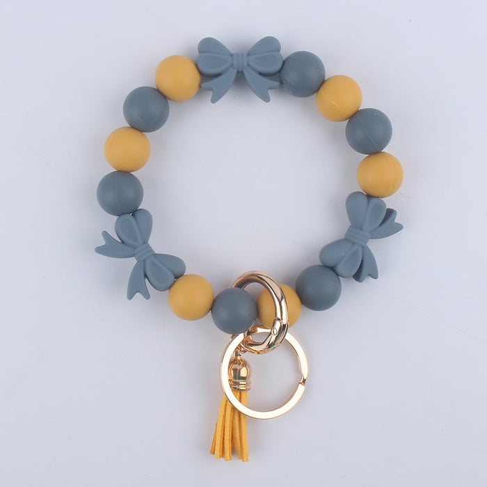 Wholesale Cartoon bow silicone bracelet keychain handmade beaded bracelet jewelry