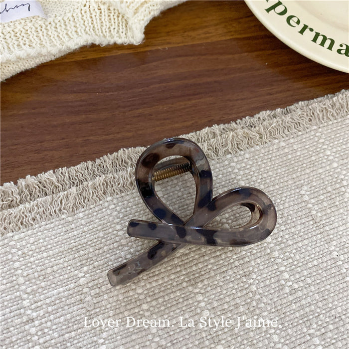 Wholesale Leopard print cross bow geometric hair clip, fashionable grip clip, versatile hair accessory