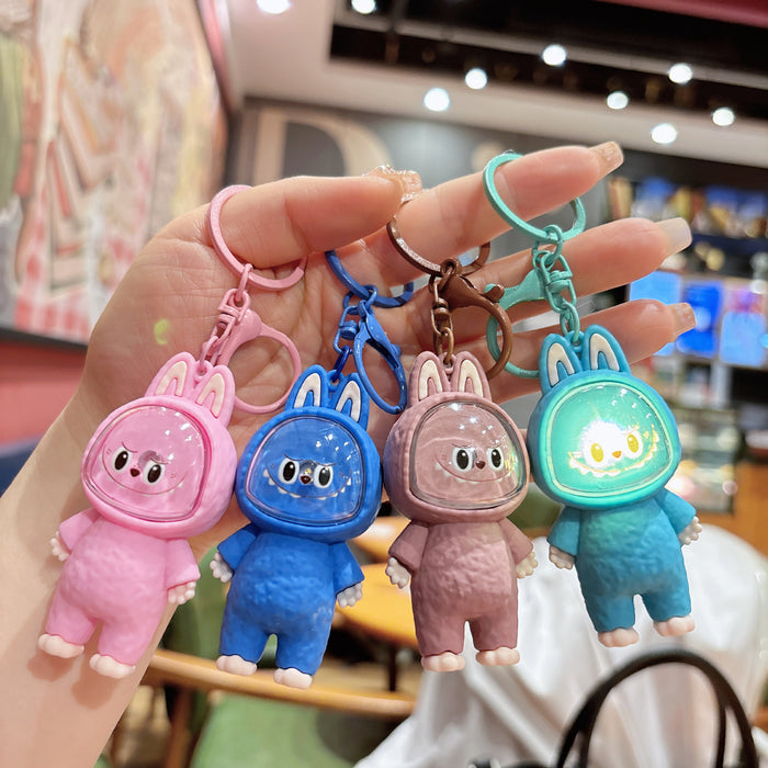 Wholesale Creative cartoon illuminated keychain figurine, car couple bag pendant, student backpack ornament