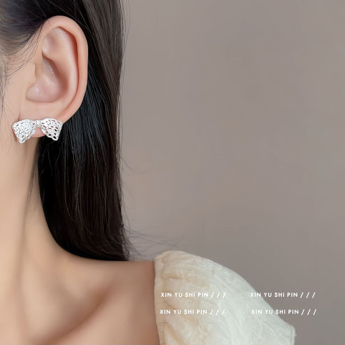 Wholesale Girl's artwork earrings with exquisite temperament, elegant fashion, and high-end feel. Earrings with hollowed out butterfly earrings