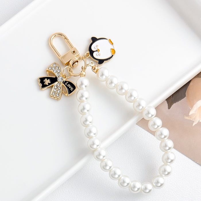 Wholesale Pearl chain beaded mobile phone lanyard bow pendant keychain