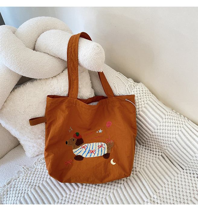 Wholesale New cute cartoon embroidered drawstring shoulder bag, fashionable and simple canvas bag, large capacity tote bag