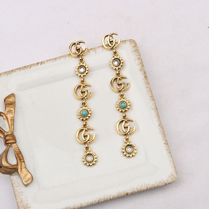 Wholesale double G Letter Elegant Versatile Tassel Earrings Daisy Accessible
