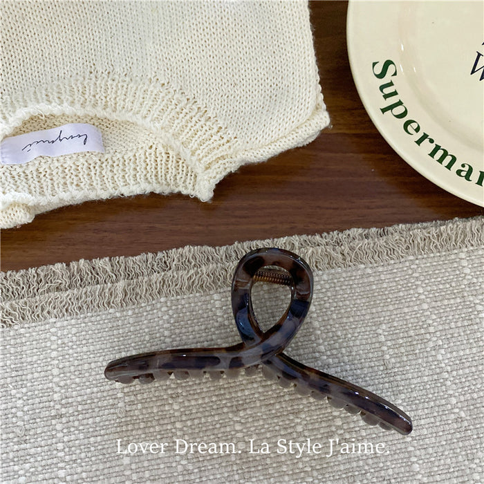 Wholesale Leopard print cross bow geometric hair clip, fashionable grip clip, versatile hair accessory