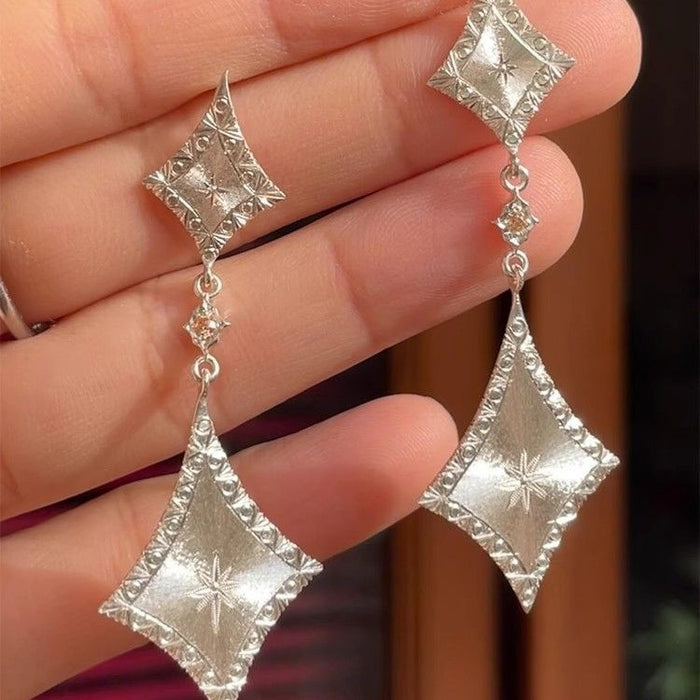 Wholesale Cool Sense Silver brushed Diamond Earrings Simple High-end Sense Italian Carved Gold Long Earrings Women' s Earrings