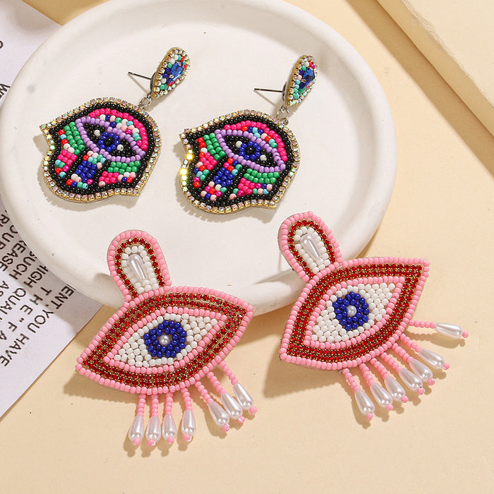 Wholesale Pink Devil' s Eye Rice Bead Earrings