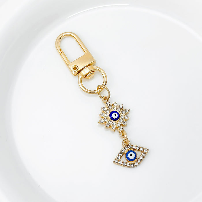 Wholesale Diamond-encrusted blue eyes evil eye tassel keychain