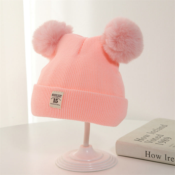 Wholesale Knitted hat with added yarn cap and fabric label
