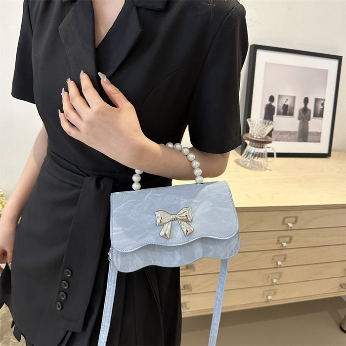 Wholesale Fashionable pearl handbag, crossbody, stylish design, butterfly texture small square bag