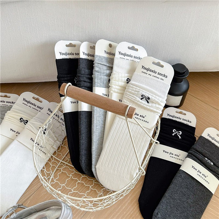 Wholesale Butterfly knot embroidered socks, solid color boneless pile socks, white socks