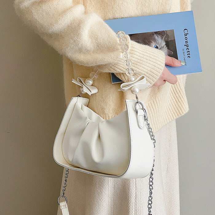 Wholesale Popular pleated new fashion pearl chain shoulder crossbody bag, saddle bag