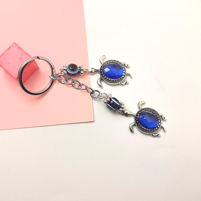 Wholesale Blue Eye Pendant Flower Butterfly Keychain Pendant Bag