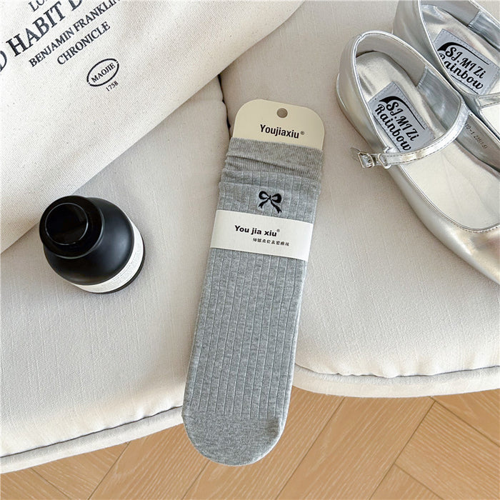 Wholesale Butterfly knot embroidered socks, solid color boneless pile socks, white socks