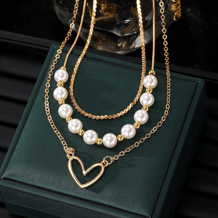 Wholesale Fashionable imitation pearl heart-shaped hollow pendant necklace, exquisite, high-end, versatile, multi-layer stacked collarbone chain