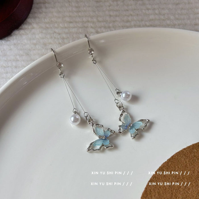 Wholesale Butterfly pearl tassel earrings with unique temperament, new earrings with distinctive features