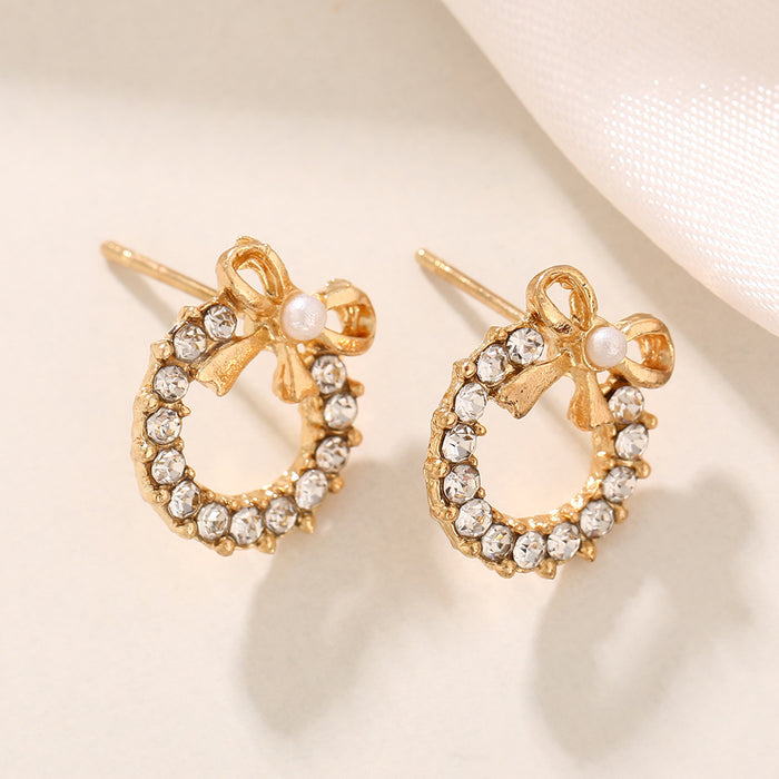 Wholesale Simple pearl bow earrings with personalized temperament, inlaid with colored diamonds, hollowed out circular earrings, and earrings