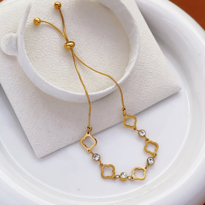 Wholesale New hollowed out clover pull-out bracelet made of titanium steel with diamonds, niche high-end handmade accessories wholesale