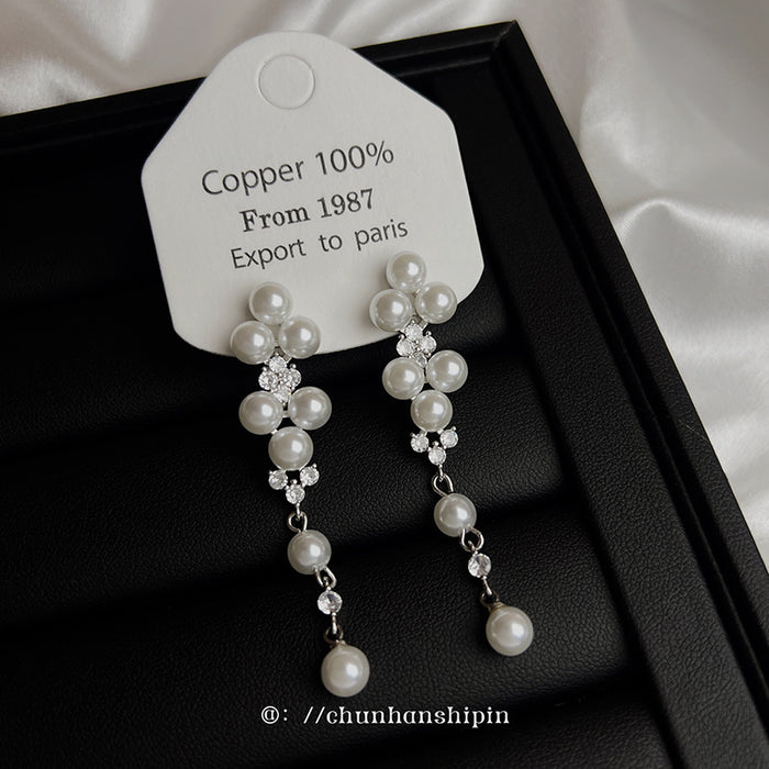 Wholesale Elegant long pearl ear clip without ear hole tassel earrings, fashionable and light luxury