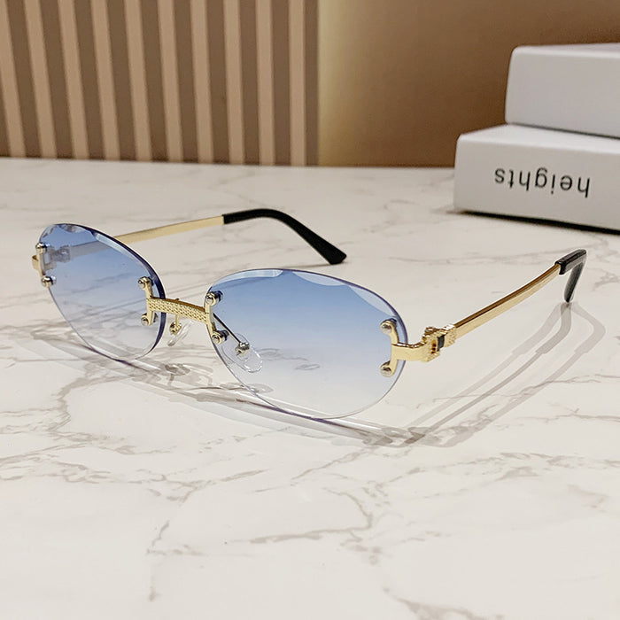 Wholesale Frameless cut sunglasses, fashionable oval frame glasses, gradient sunglasses