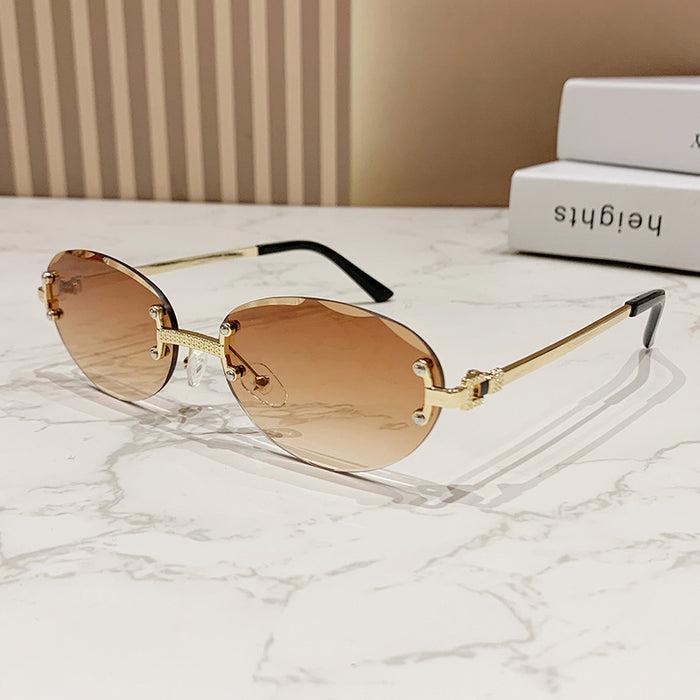 Wholesale Frameless cut sunglasses, fashionable oval frame glasses, gradient sunglasses