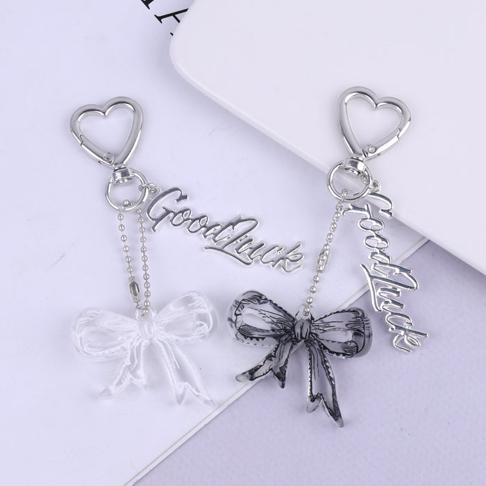 Wholesale Trendy black and white transparent bow acrylic heart keychain bag pendant personalized letter creative accessories
