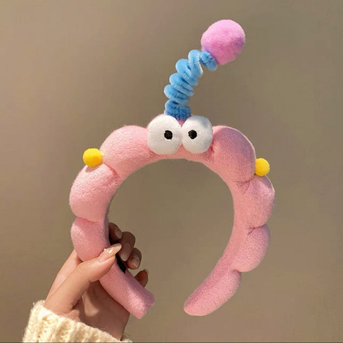 Wholesale Cute girl' s twistable hairband with big-eyed plush toy design.