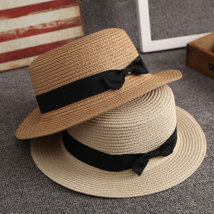Wholesale New wide eave flat top straw hat for sun protection, vacation bow top hat for versatile sun protection