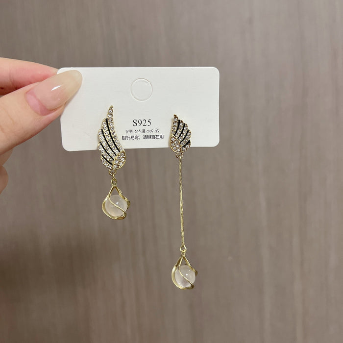Wholesale Trendy AB asymmetrical diamond studded wing tassel cat eye stone earrings with atmospheric and exquisite earrings