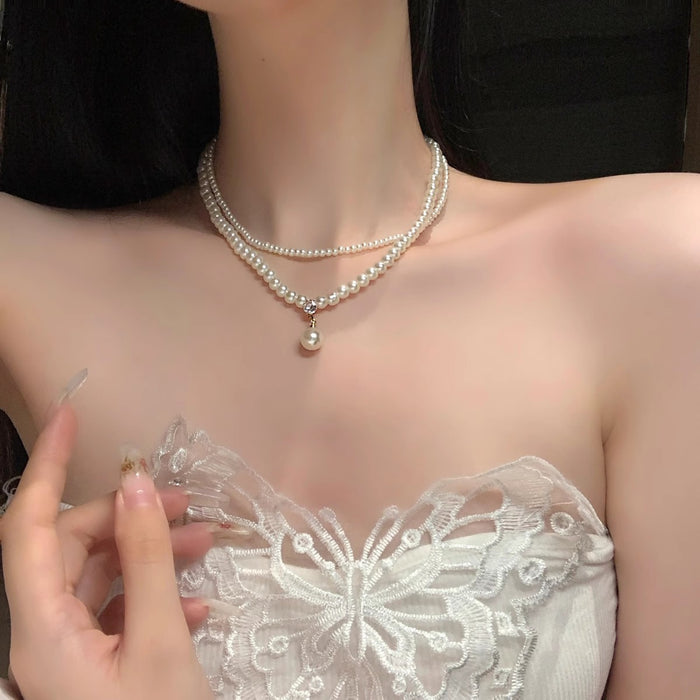 Wholesale Retro pearl double layered necklace with high-end feel, light luxury, niche collarbone chain