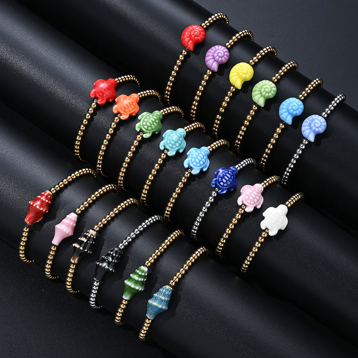 Wholesale Swimming wearable mini bracelet accessory ceramic conch animal turtle titanium steel non fading bracelet