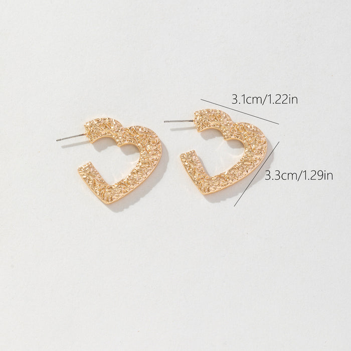 Wholesale Valentine' s Day gold plated embossed hammered texture heart  shaped hollow stud earrings