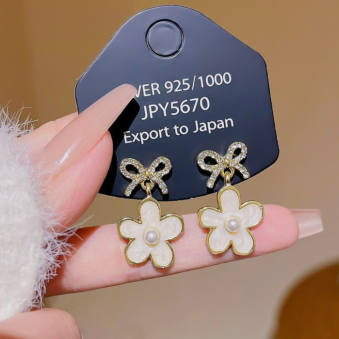 Wholesale Temperament bow flower pearl earrings fashion light luxury earrings niche feeling same style versatile earrings wholesale