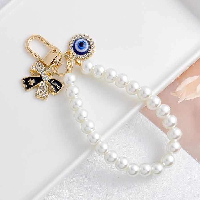 Wholesale Pearl chain beaded mobile phone lanyard bow pendant keychain