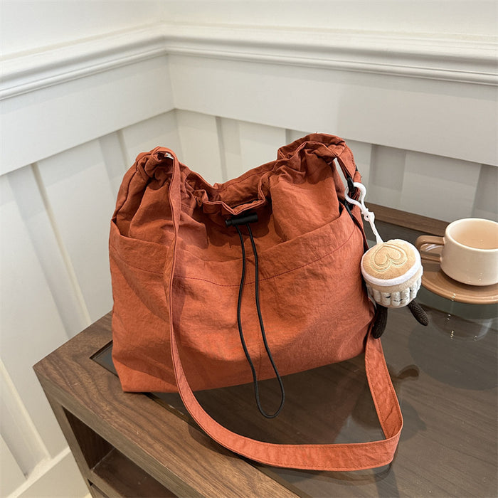Wholesale Niche casual artistic canvas bucket bag, fashionable drawstring single shoulder pleated nylon crossbody bag