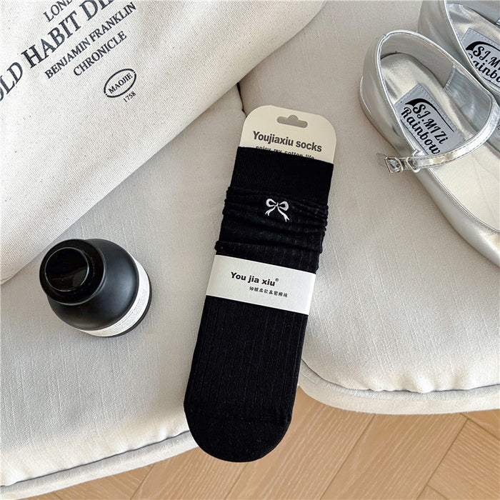 Wholesale Butterfly knot embroidered socks, solid color boneless pile socks, white socks