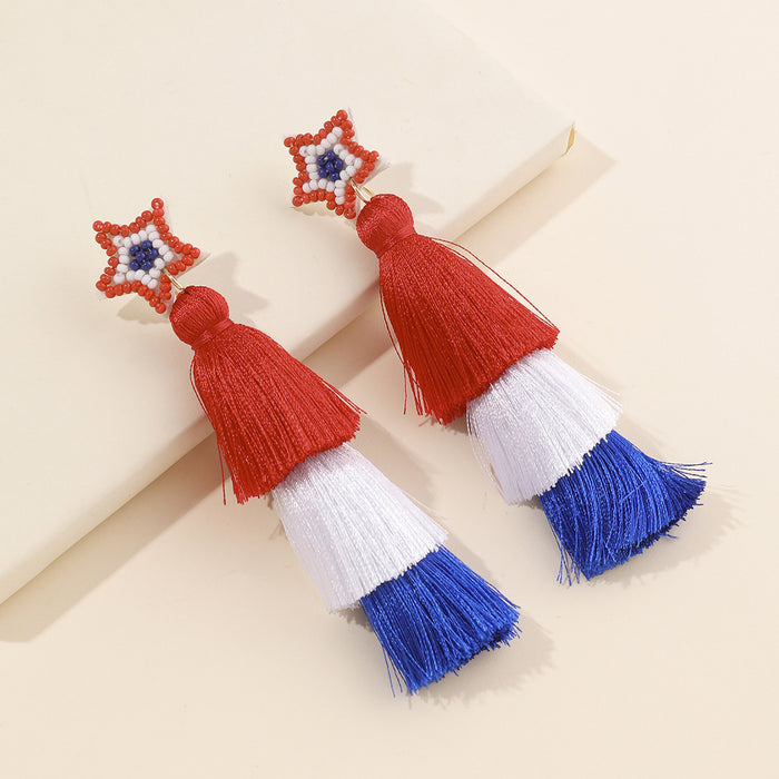 Wholesale Red, blue, and white rainbow shaped woven cotton rope tassel with sparkling pink acrylic earrings