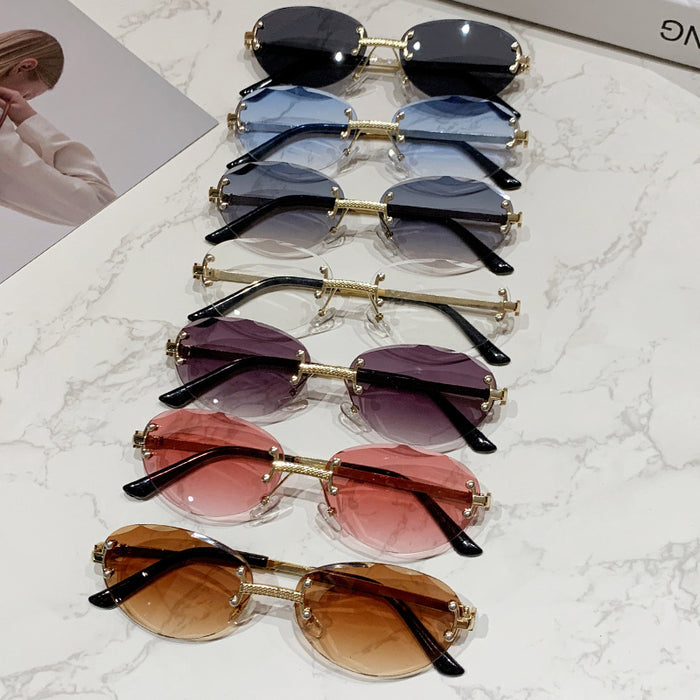Wholesale Frameless cut sunglasses, fashionable oval frame glasses, gradient sunglasses