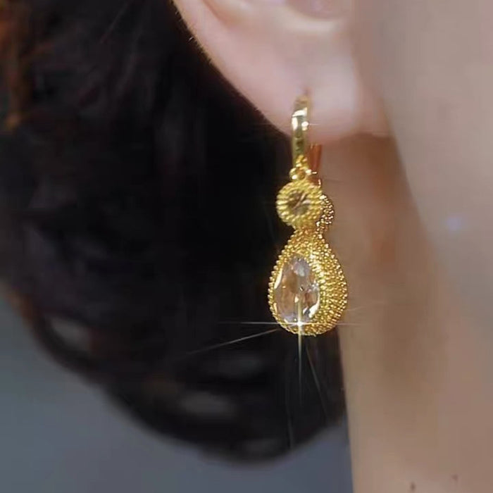 Wholesale Light luxury high-end coffee colored zircon earrings for women, with a niche design and versatile temperament. Earrings with fashionable water droplet earrings and buckles