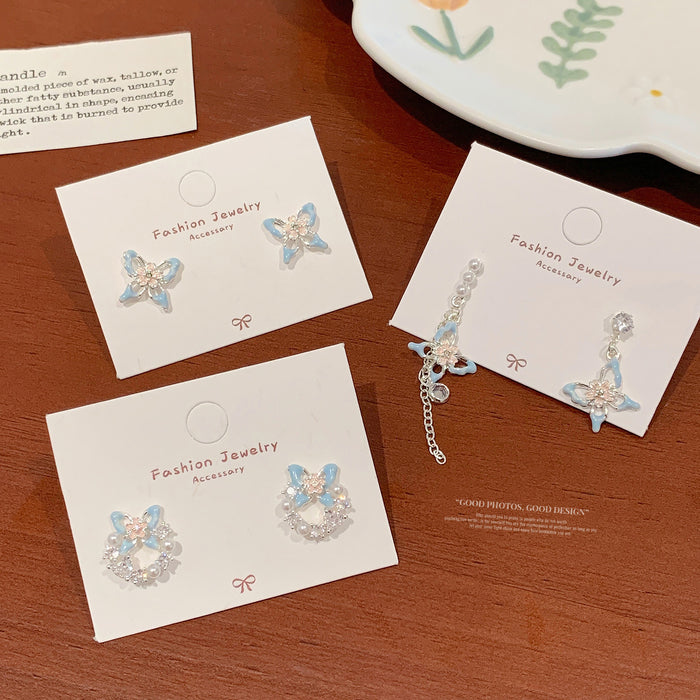 Wholesale Sweet and exquisite butterfly cherry blossom pearl earrings with silver needles, niche design, high-end and versatile earrings