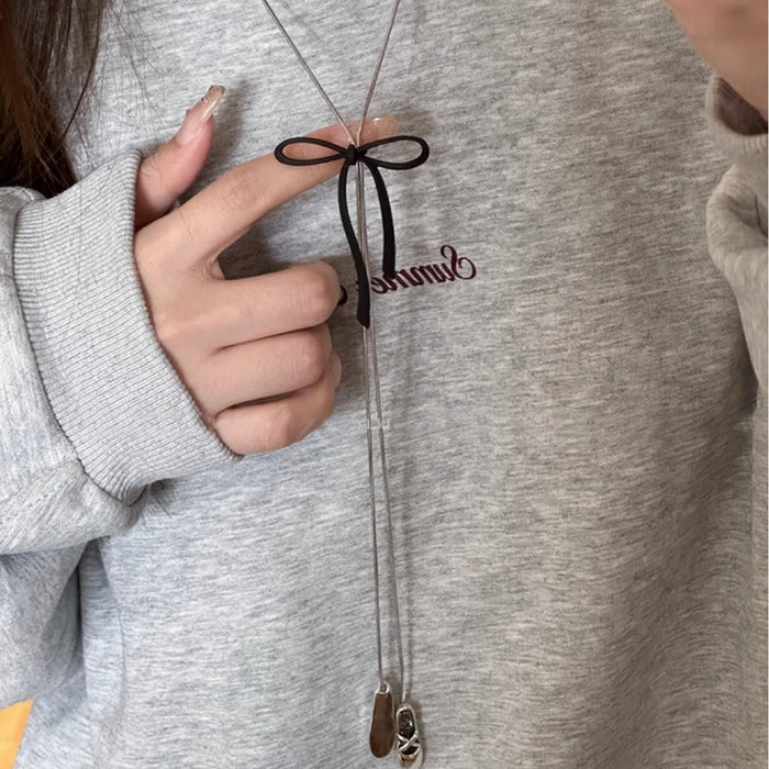 Wholesale Black bow pendant necklace with a sense of design, long sweater chain