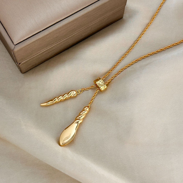 Wholesale Gold long drawable twisted necklace accessory, light luxury, niche, high-end, temperament pendant, sweater chain