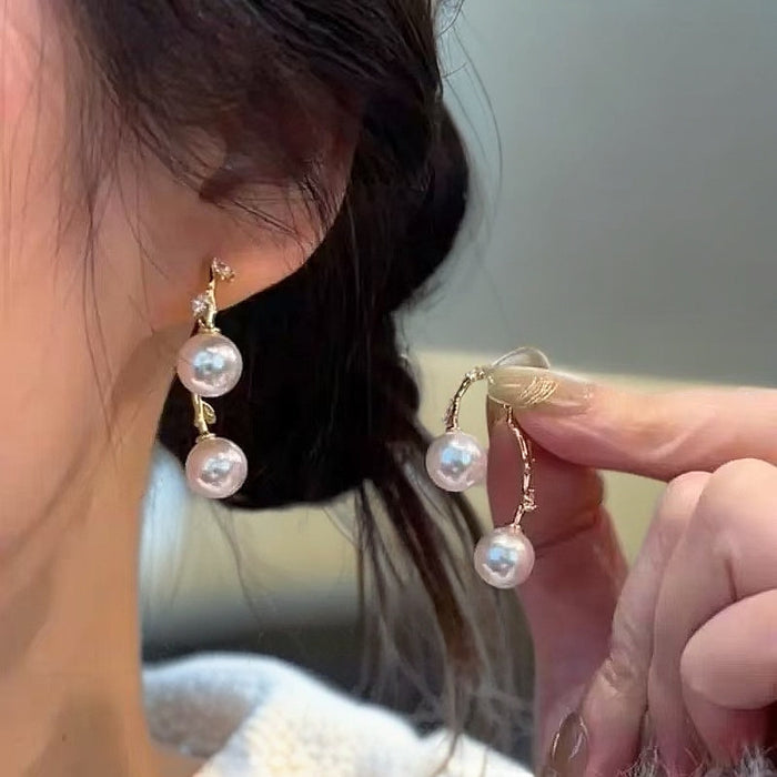 Wholesale A pair of cross leaf pearl earrings with light luxury temperament, fashionable and versatile ear accessories