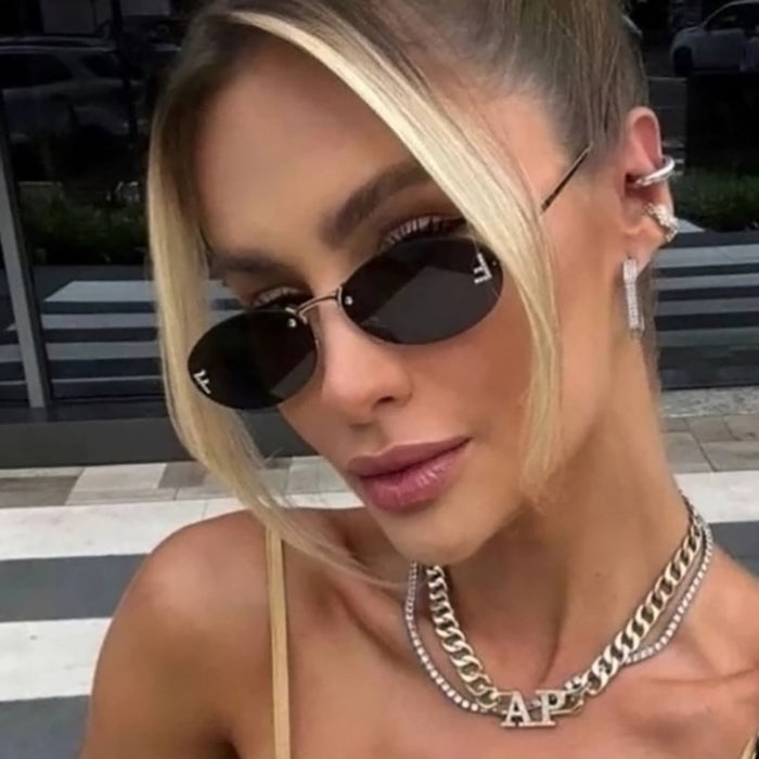 Wholesale Elliptical frame small frame sunglasses, new frameless cut edge personalized glasses, dot diamond sunglasses