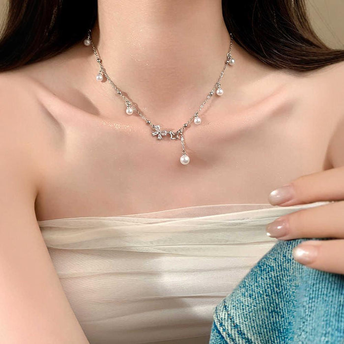 Wholesale Asymmetric hollow butterfly pearl necklace, light luxury, niche collarbone chain accessory, neckchain