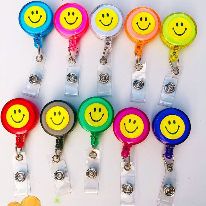 Wholesale Smiley face pull buckle retractable buckle Badge Reels Keychains