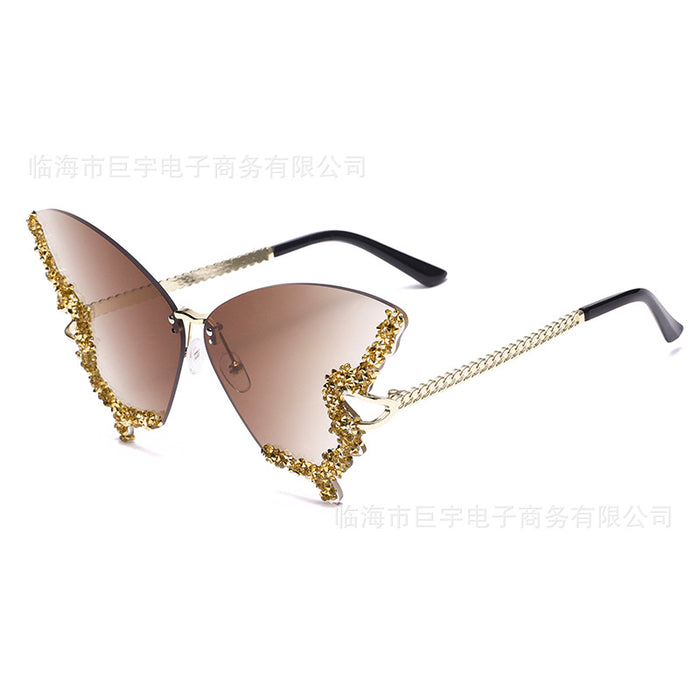 Wholesale Butterfly shaped diamond studded frameless sunglasses for women with fashionable personality and exaggerated sunglasses